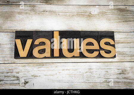 The word "values" written in wooden letterpress type on a white washed old wooden boards background. Stock Photo