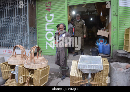 Lahore, Pakistan. 17th June, 2017. Pakistani security personnel busy in searching and clear the market near Imambargah karbala Gamay shah before procession, Youm-e-Ali. Youm-e-Ali (RA)the martyrdom day of Hazrat Ali (RA) processions is being observed today (Saturday) with religious harmony amid tight security across the country. Credit: Rana Sajid Hussain/Pacific Press/Alamy Live News Stock Photo