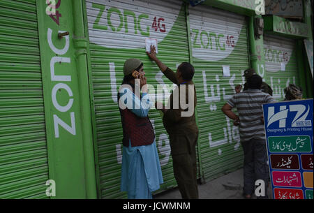 Lahore, Pakistan. 17th June, 2017. Pakistani security personnel busy in searching and clear the market near Imambargah karbala Gamay shah before procession, Youm-e-Ali. Youm-e-Ali (RA)the martyrdom day of Hazrat Ali (RA) processions is being observed today (Saturday) with religious harmony amid tight security across the country. Credit: Rana Sajid Hussain/Pacific Press/Alamy Live News Stock Photo