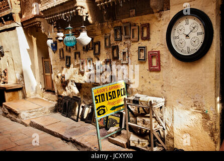 Rustic and quaint shop on a street in Jaisalmer fort in the famous desert state of Rajasthan in India. Gift shop seller of handicrafts and souvenirs Stock Photo