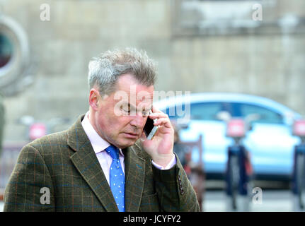 Peter Whittle (UKIP deputy leader) on College Green, Westminster 18th April 2017 shortly after a general election was announced. On his mobile phone Stock Photo