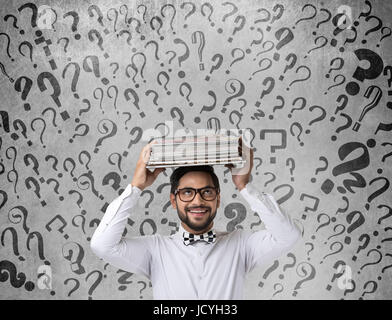 Businessman holding files looking for business solution Stock Photo