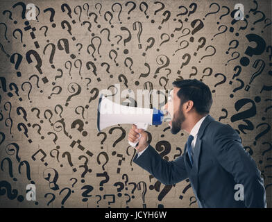 Businessman shouting on megaphone Stock Photo