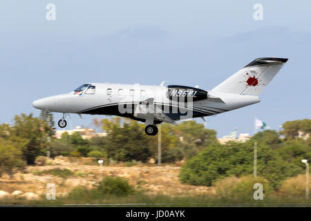 A private Cessna 525 CitationJet M2 [N95KL] on short finals runway 31. Stock Photo