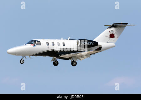 A private Cessna 525 CitationJet M2 [N95KL] on short finals runway 31. Stock Photo