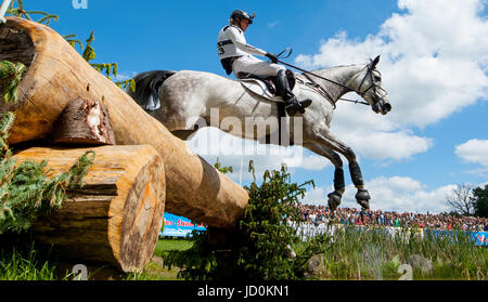 Luhmuehlen, Germany. 17th June, 2017. German eventing rider Ingrid Klimke jumps over a hurdle on her horse Weisse Duene in Luhmuehlen, Germany, 17 June 2017. Photo: Philipp Schulze/dpa/Alamy Live News Stock Photo
