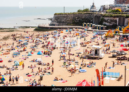 View along Viking Bay beach at Broadstairs during the daytime in the summer. Packed with crowds of people on sunbathing Stock Photo