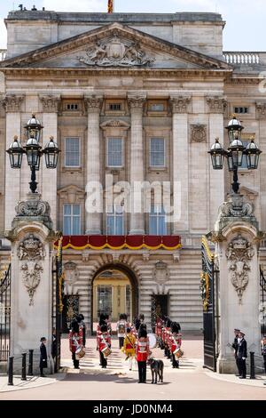 London, UK. 17th June, 2017. Irish Guards outside Buckingham Palace following Trooping the Colour in London, UK. 17th June, 2017. The Irish guards with their regimental mascot, a wolfhound named Domhnall . Trooping the Colour is the official annual celebration of the Queen's 91st birthday Credit: Julie Edwards/Alamy Live News Stock Photo