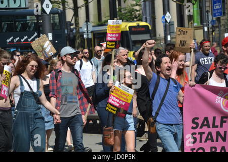 Manchester, UK. 17th June, 2017. Protestors take part in a march against the Tory-DUP government with placards and posters. ‘Justice for Grenfell: Tories Out, No DUP’ protest organised by members of the Socialist Worker’s Party, Labour Party and Jeremy Corbyn supporters in Manchester Albert Square on Saturday 17th June 2017. Credit: Pablo O'Hana/Alamy Live News Stock Photo