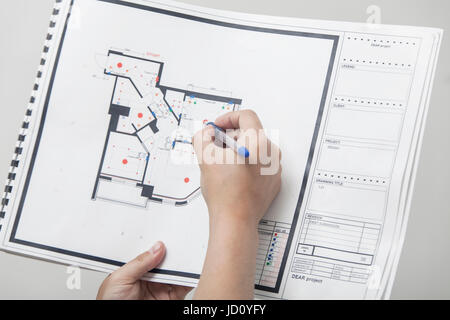 The architect studies the drawing of the new apartment Stock Photo