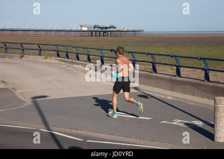 Southport, Merseyside, UK. UK Weather. 18th June, 2017.  Sunny start to the day on the resorts promenade with expectations of another hot day for many with plenty of sunshine. Credit; MediaWorldImages/AlamyLiveNews. Stock Photo