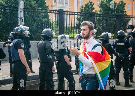 Kyiv, Ukraine. 18th June, 2017. LGBT activists take part in a march of Kyiv Pride 2017. The road was partly blocked by groups of nationalistic activists, but the distance of 1200 metres was passed by the Pride participants without accidents. More than 2000 people took part in the Pride. Credit: Kateryna Olexenko/Alamy Live News Stock Photo