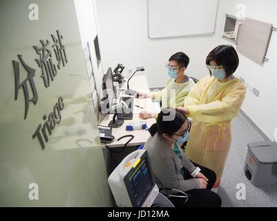 Hong Kong, China. 6th Mar, 2017. Medical personnel take part in an emergency drill at a hospital in Tin Shui Wai in Hong Kong, south China, March 6, 2017. Over the past 20 years, Tin Shui Wai has witnessed the dramatic development of Hong Kong. The year 2017 marks the 20th anniversary of Hong Kong's return to the motherland. Credit: Wang Shen/Xinhua/Alamy Live News Stock Photo