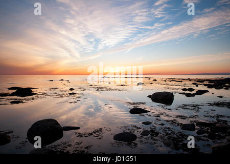 Sunset on beach in Gros Morne National Park, near Rocky Harbou, Newfoundland, Canada Stock Photo