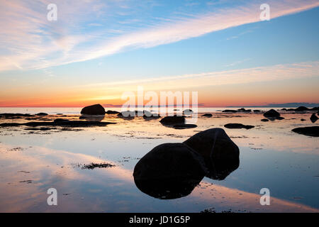 Sunset on beach in Gros Morne National Park, near Rocky Harbour, Newfoundland, Canada Stock Photo