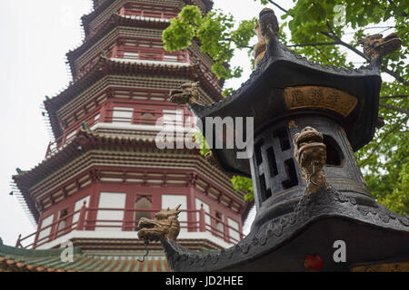 Ancient incense house dragon in front of the 6th century Temple of the Six Banyan Trees pagoda - one of Guangzhou's oldest Chinese Buddhist temples, C Stock Photo