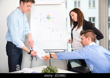 Business People Discussing Over Document In Office Stock Photo