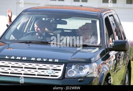 The Duke of Edinburgh and Queen Elizabeth II leave after attending the Cartier Queen's Cup polo tournament final at Guards Polo in Windsor Great Park, Berkshire. Stock Photo