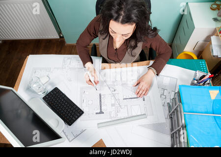 Top view of architect working at her desk Stock Photo