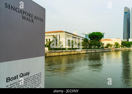 Boat Quay, a historical district in Singapore with tall skyscrapers the central business district in background Stock Photo