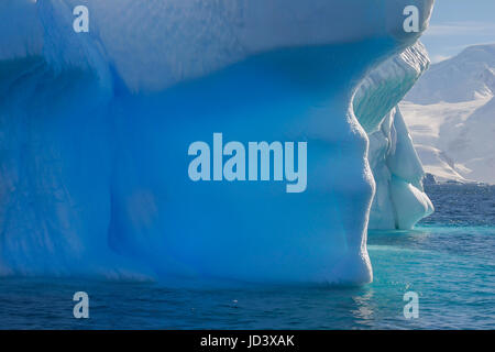 Blue shimmering beautiful iceberg in Antarctica Stock Photo