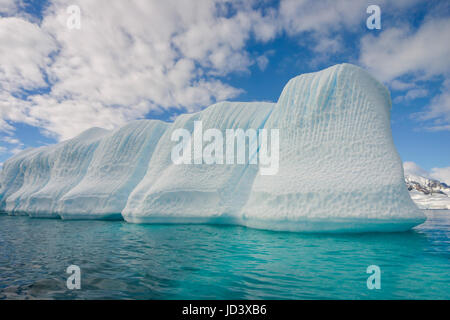 Blue shimmering beautiful iceberg in Antarctica Stock Photo