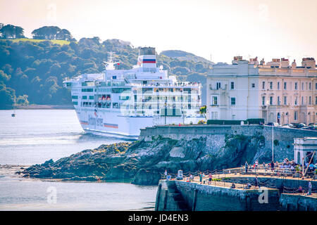 large Brittany Ferries ferry Pont Aven sailing into port with houses next to it, Millbay Docks, Plymouth Sound, The Hoe, Devon, England, UK Stock Photo