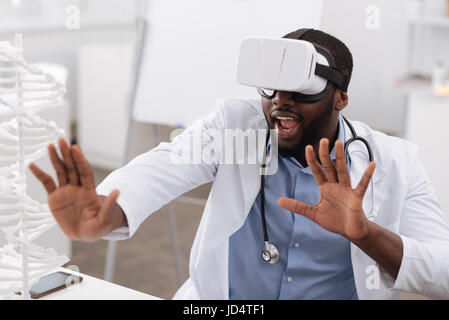 Nice professional doctor using the newest technologies Stock Photo