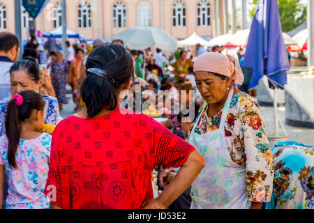 SAMARKAND, UZBEKISTAN - AUGUST 28: Women selling fruits at Siab bazaar; local fruit, vegetable and spices market in Samarkand, August 2016 Stock Photo