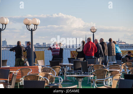 TALLINN, ESTONIA - AUGUST 20, 2016: People are enjoying start of trip on the ferry deck Stock Photo