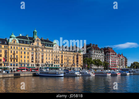 STOCKHOLM - SEPTEMBER, 15, 2016: Daytrip cruise boats along small harbor in center of Stockholm Stock Photo