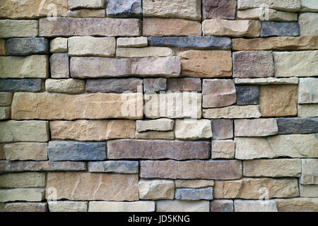 Stone Blocks Wall Made from Irregular Sized Stone Blocks, for Abstract Background Stock Photo