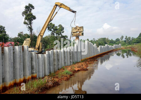 Piling machine works  on a bridge pile construction. Stock Photo