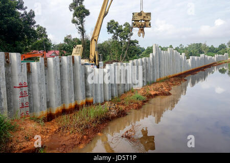 Piling machine works  on a bridge pile construction. Stock Photo