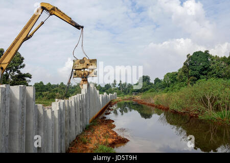 Piling machine works  on a bridge pile construction. Stock Photo