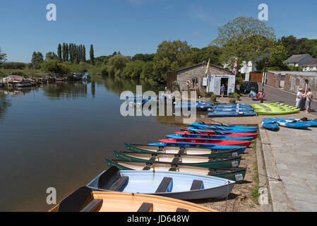 Boats for hire on Abbots Quay along the River Frome in Wareham, Dorset England UK. Stock Photo