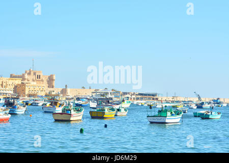 Qaitbay Castle and fishing boats in Eastern Harbor Alexandria Egypt ...