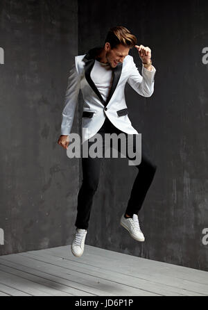 Portrait of a cheerful, dancing young model Stock Photo