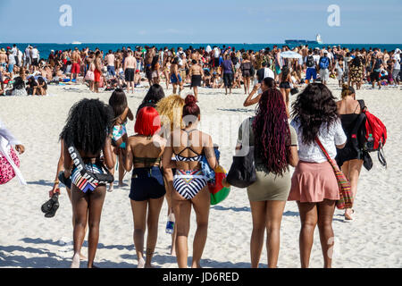 Miami Beach Florida,Atlantic Ocean,Spring Break,sand,Black man men male,woman female women,crowd,young adult,college students,social gathering,urban,b Stock Photo