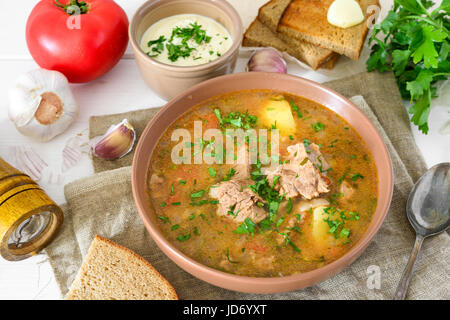 Kharcho is georgian soup with rice and meat served with bread Stock Photo