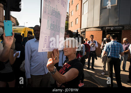 Finsbury Park, London, UK. 19th June, 2017. Crowds have gathered following a suspected terrorist attack earlier this morning. In picture: A protestor holds a sign. Credit: Byron Kirk/Alamy Live News Stock Photo