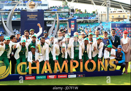 Pakistan players and head coach Mickey Arthur lift the trophy after wining the ICC Champions Trophy final at The Oval, London. Stock Photo