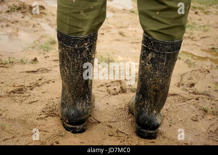 Muddy boots Stock Photo