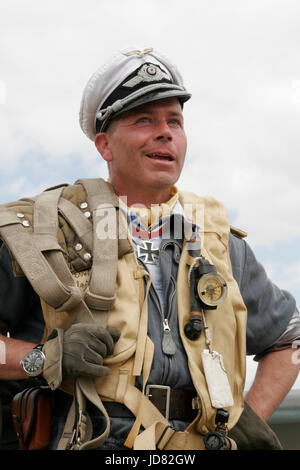 Luftwaffe Pilot wearing open back Schwimmweste, White top peaked cap carrying Parachute harness Stock Photo