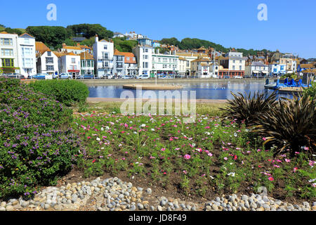 A view of the seafront at Hastings seen through a flower bed Stock Photo