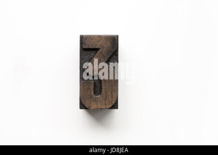 Old letterpress number 3 printing block isolated on a white background ...