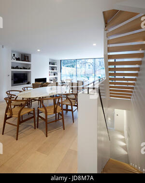 Overall view on ground floor showing stairs to basement. Notting Hill House, London, United Kingdom. Architect: Michaelis Boyd Associates Ltd, 2017. Stock Photo
