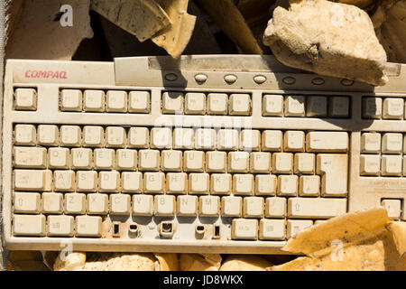 An old abandoned and very broken Compaq keyboard Stock Photo