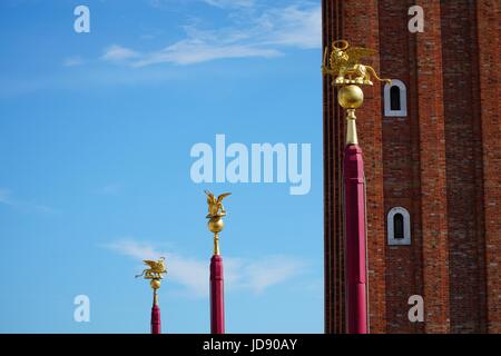 Gold Lions on Poles & Campanile in Piazza San Marco Stock Photo