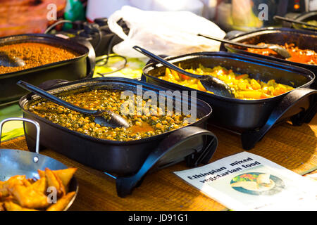 Ethiopian dishes at a food market (Sunday UpMarket, Old Truman Brewery Boiler House Food Hall, Brick Lane, London, UK) Stock Photo